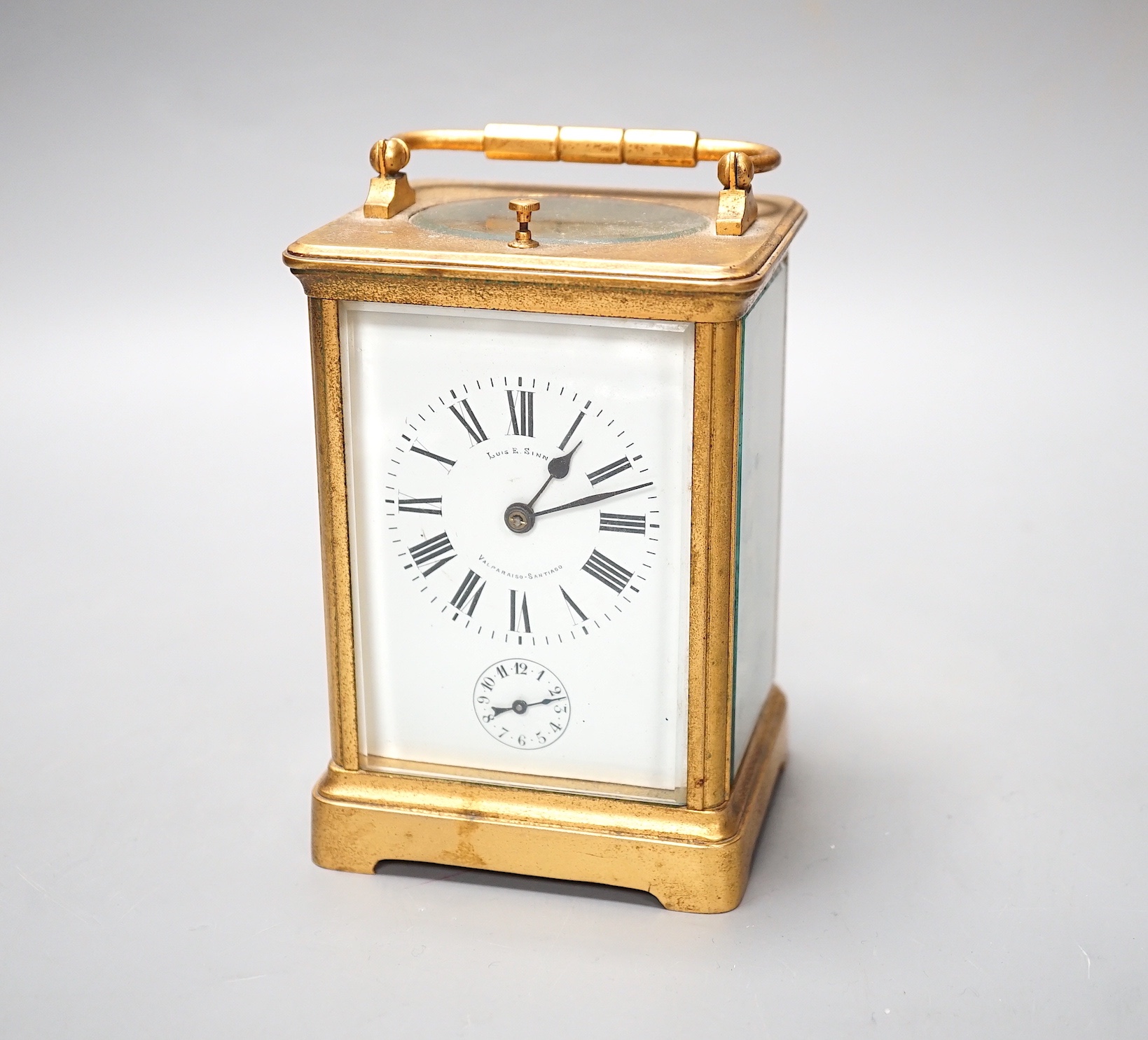 A French brass carriage clock with alarm and push repeat, retailers mark Luis E. Sinn Co. - 15cm